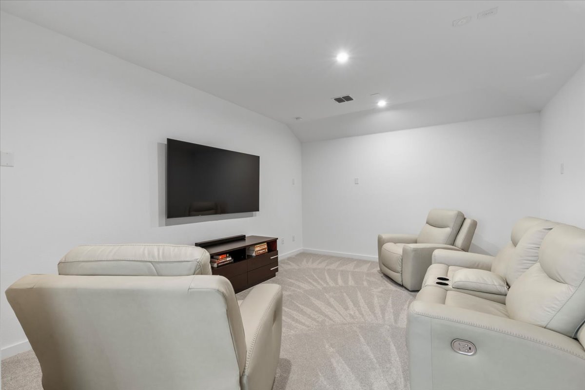 1904 Varese Path Leander, TX 78641 - Photo 23 of 40 a living room with furniture and a flat screen tv