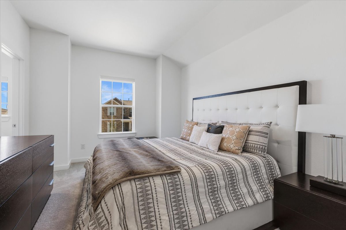 1904 Varese Path Leander, TX 78641 - Photo 24 of 40 a bedroom with a bed and window