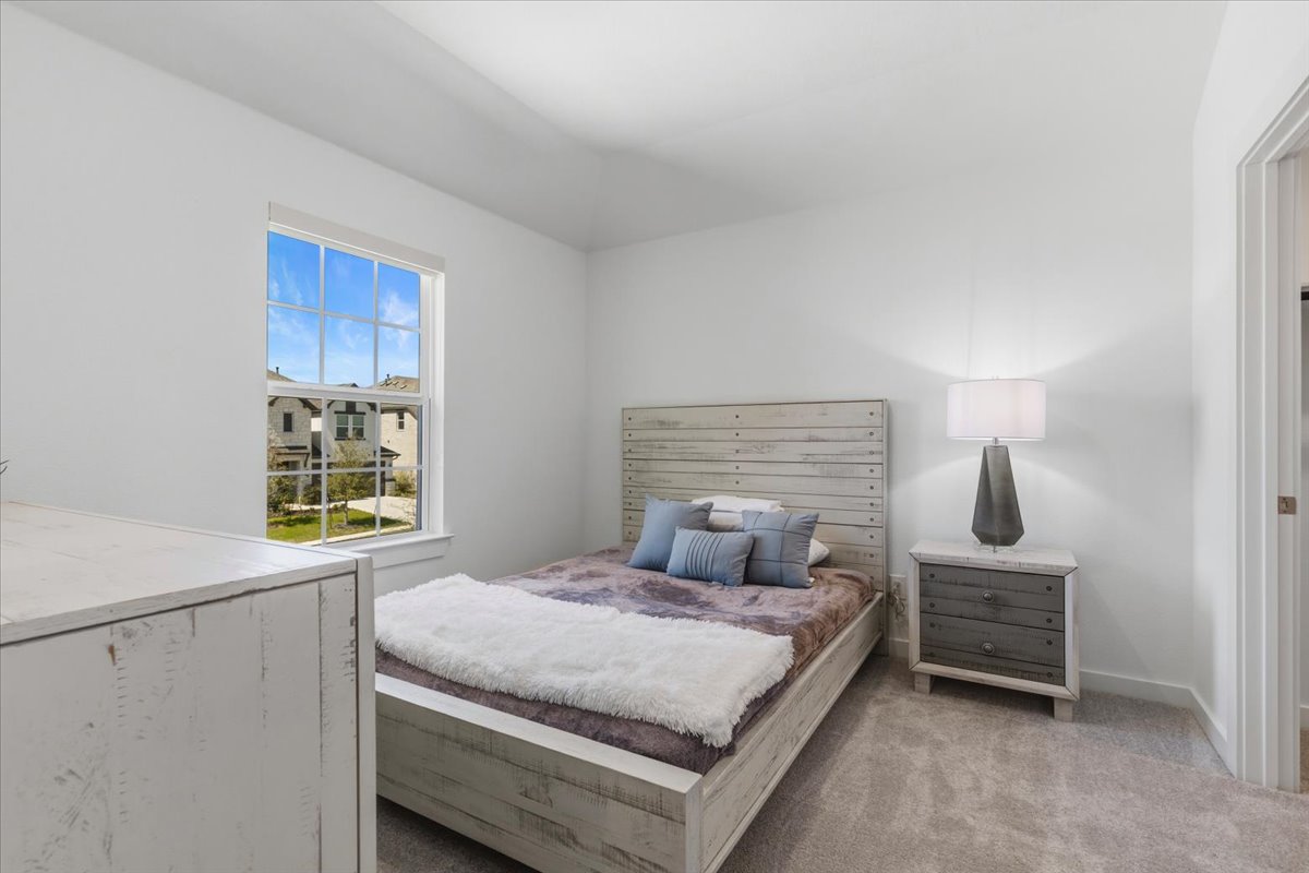 1904 Varese Path Leander, TX 78641 - Photo 25 of 40 a bedroom with a bed and a window
