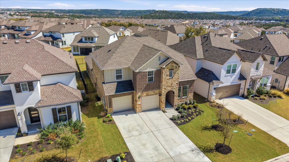 1904 Varese Path Leander, TX 78641 - Photo 2 of 40 an aerial view of residential houses with outdoor space