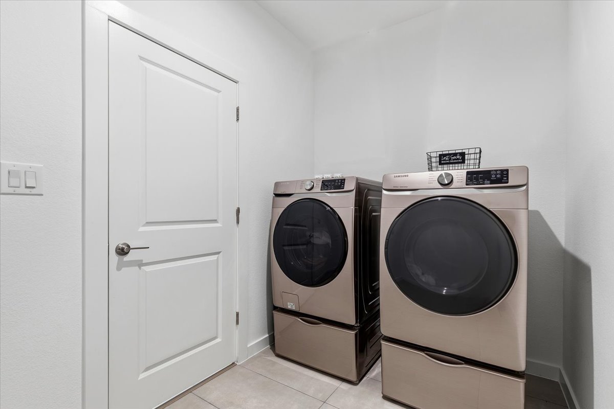 1904 Varese Path Leander, TX 78641 - Photo 30 of 40 a utility room with dryer and washer