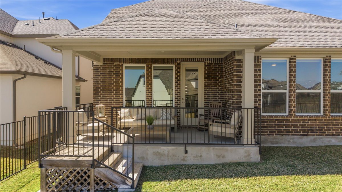 1904 Varese Path Leander, TX 78641 - Photo 34 of 40 a view of a brick house with large windows