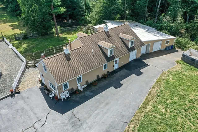 a view of a house with a yard porch and sitting area