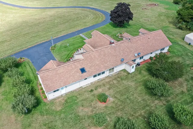 an aerial view of a house with outdoor space