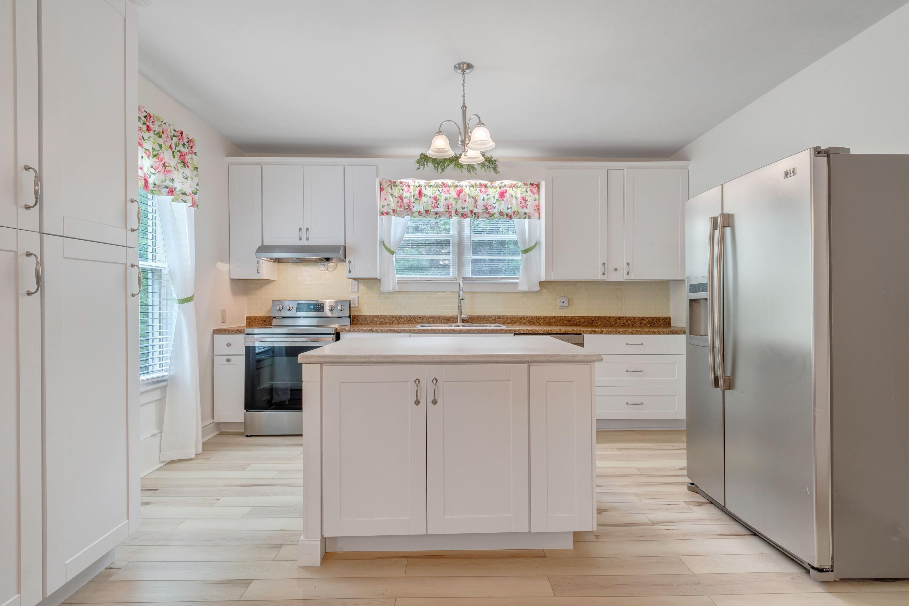 3759 Mill Iron Road Goodview, VA 24095 - Photo 12 of 39 a kitchen with granite countertop a refrigerator and a sink