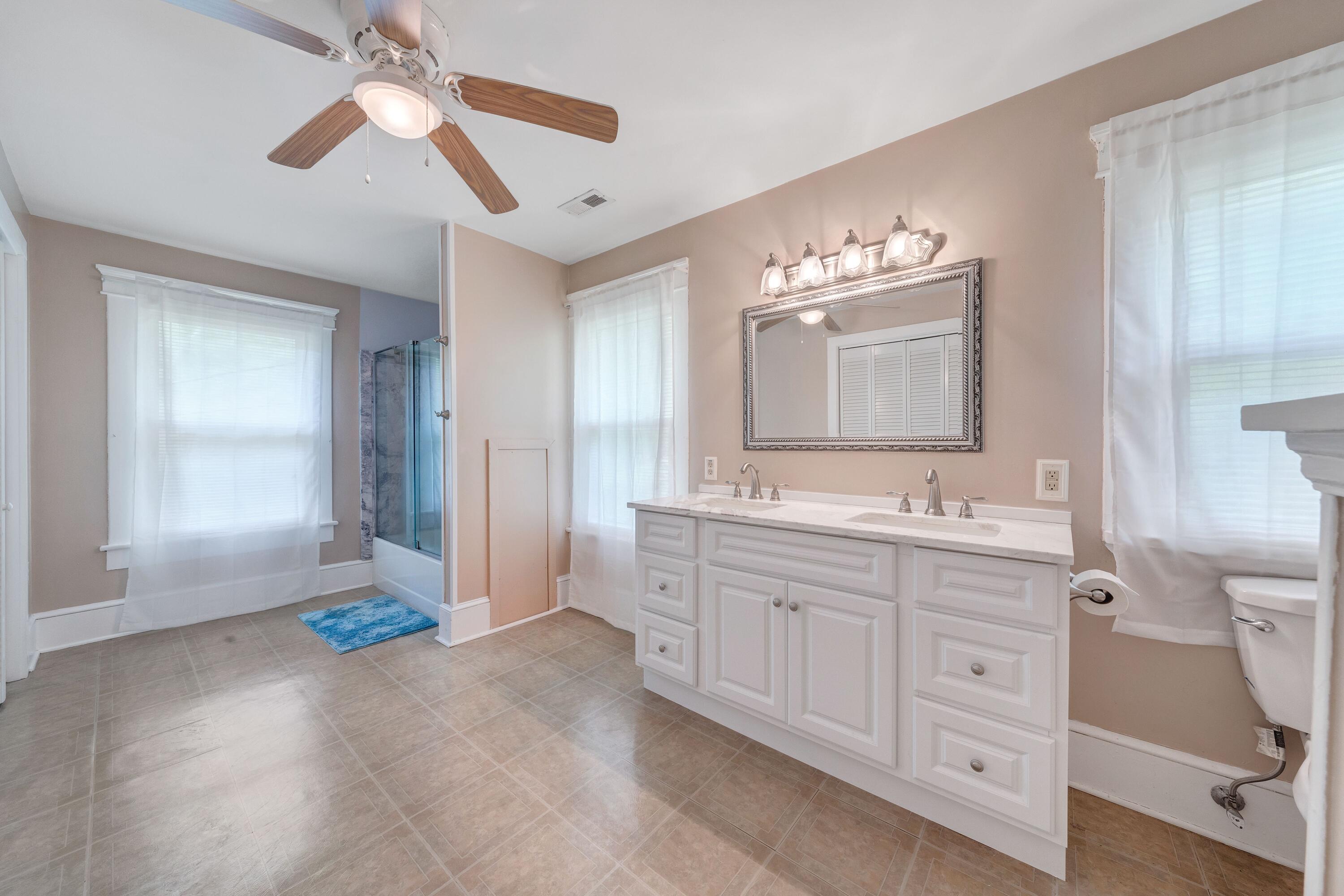 3759 Mill Iron Road Goodview, VA 24095 - Photo 24 of 39 a spacious bathroom with a double vanity sink and a mirror
