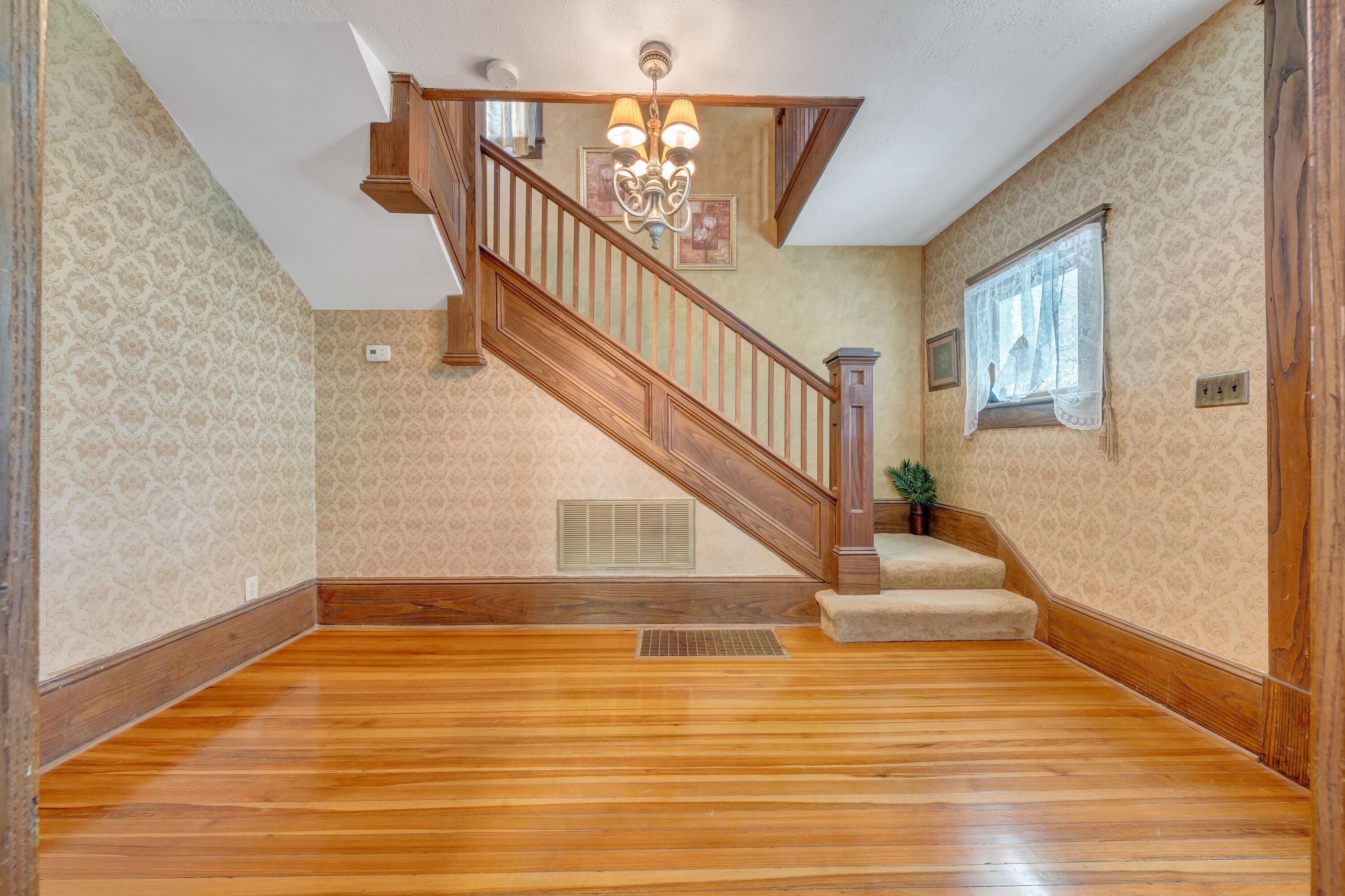 3759 Mill Iron Road Goodview, VA 24095 - Photo 6 of 39 a view of entryway and hall with wooden floor