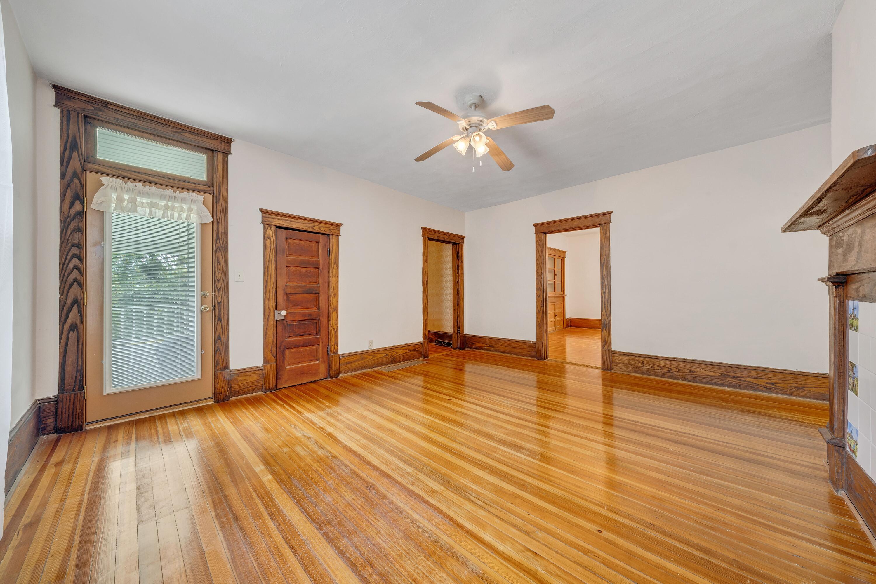 3759 Mill Iron Road Goodview, VA 24095 - Photo 9 of 39 a view of empty room with wooden floor and fan