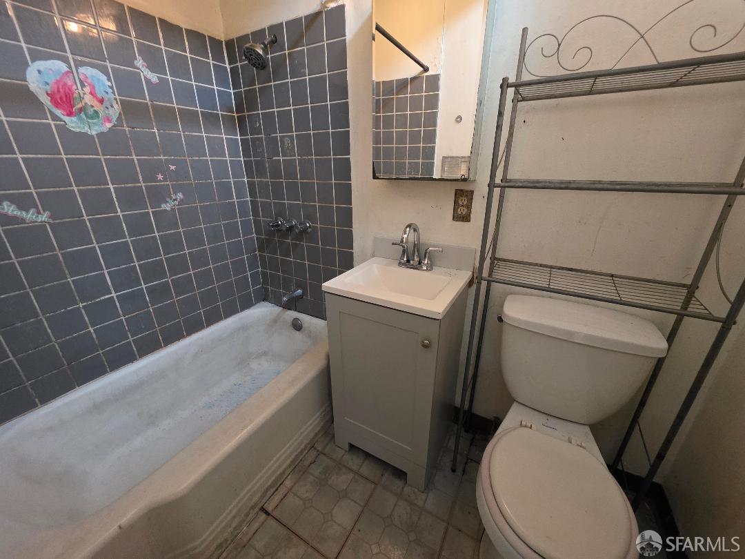 2511 24th Avenue Oakland, CA 94601 - Photo 4 of 5 a bathroom with a sink toilet and shower