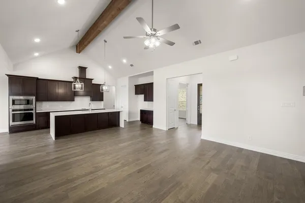 a view of kitchen with microwave and cabinets
