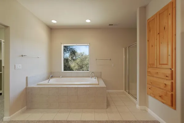 a bedroom with a bed and wooden balcony