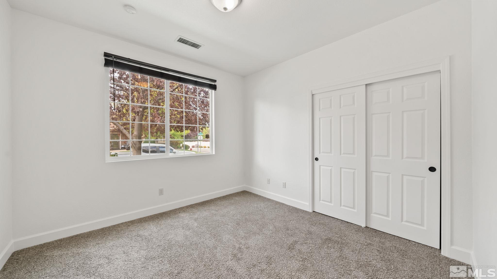 11074 Colton Drive Reno, NV 89521 - Photo 5 of 28 an empty room with windows