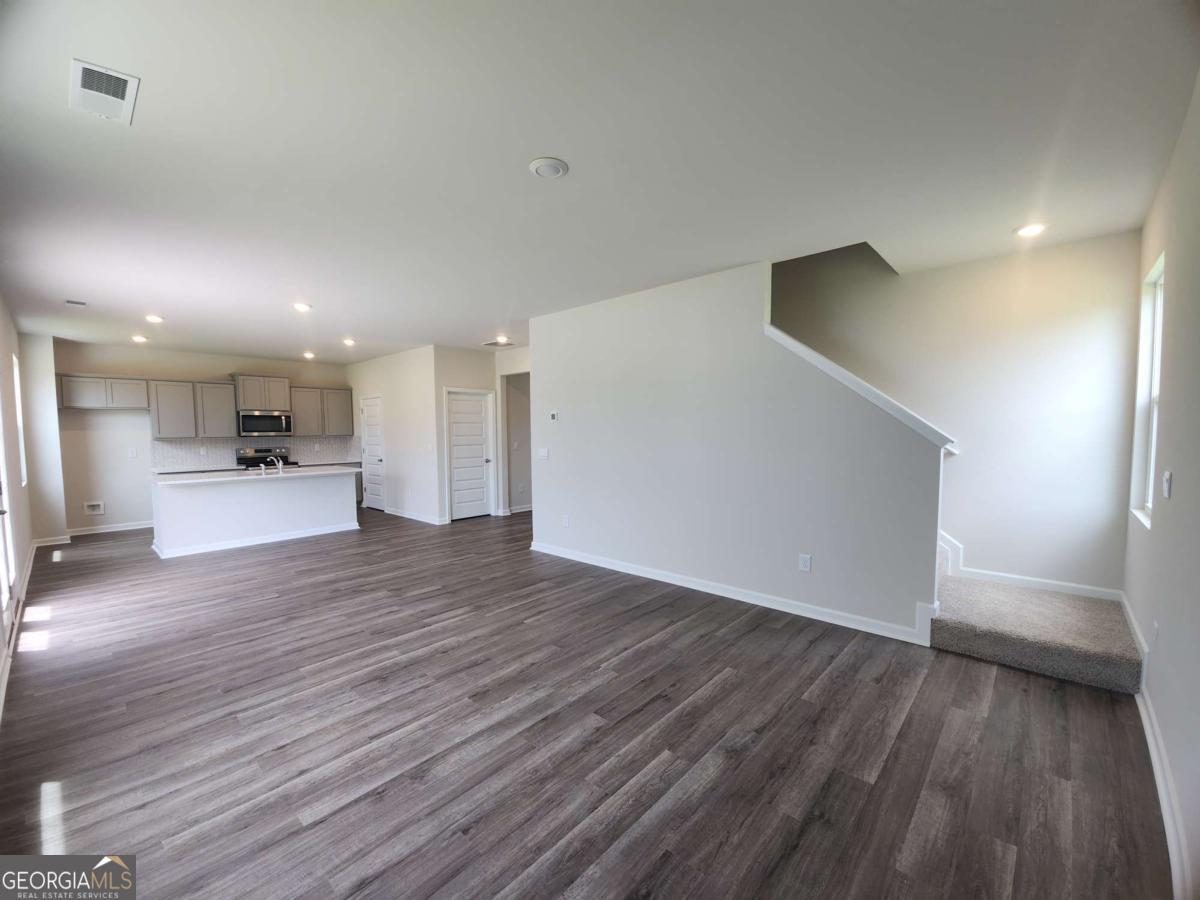 146 Aster Avenue Locust Grove, GA 30248 - Photo 15 of 25 a view of kitchen with a sink and wooden floor