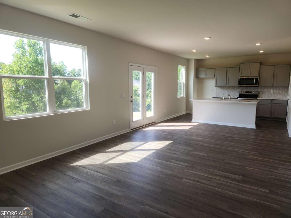 146 Aster Avenue Locust Grove, GA 30248 - Photo 2 of 25 a view of kitchen with refrigerator and window