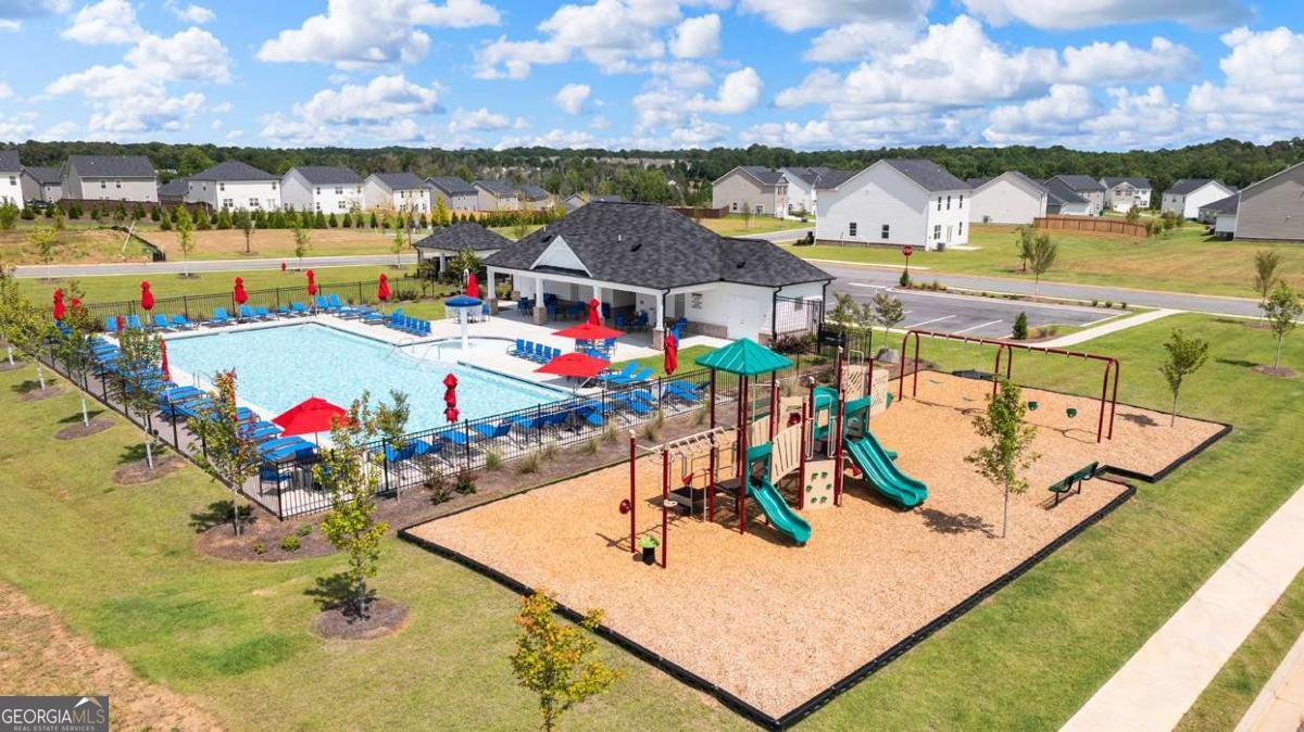146 Aster Avenue Locust Grove, GA 30248 - Photo 25 of 25 swimming pool view with sitting space