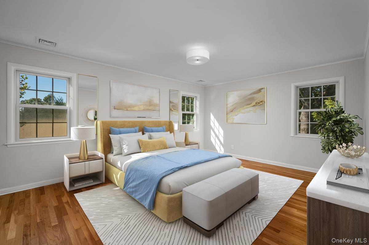 15 Hillside Road Bronxville, NY 10708 - Photo 12 of 30 a bedroom with a bed wooden floor and window