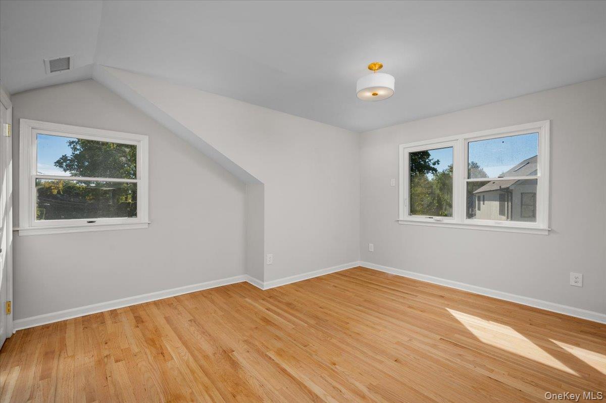 15 Hillside Road Bronxville, NY 10708 - Photo 21 of 30 a view of empty room with window and wooden floor