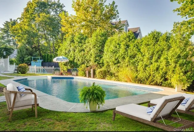 a view of a swimming pool with a patio