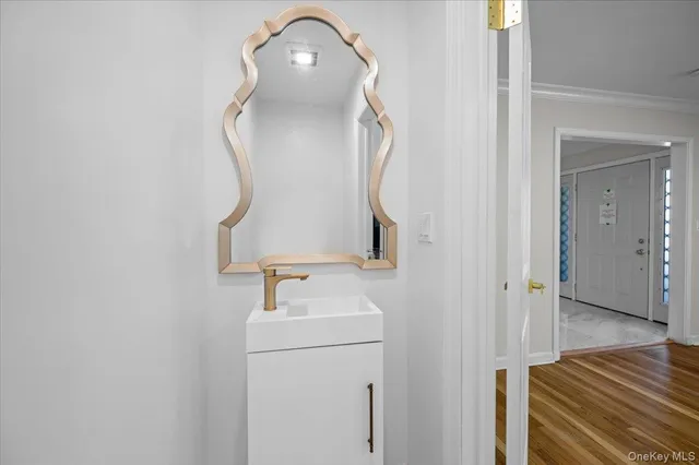 a bathroom with a sink and mirror