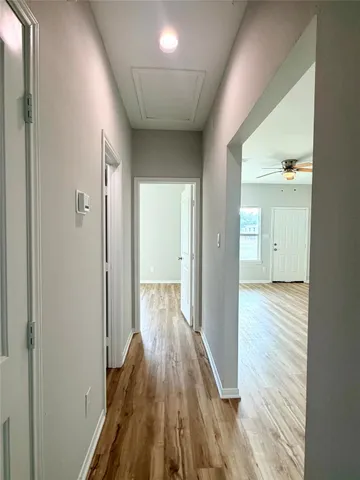 a bathroom with a granite countertop sink toilet and bathtub