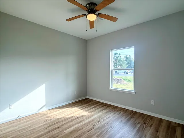 a view of an outdoor space and a ocean from a window