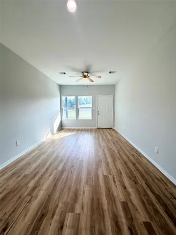 a stove top oven sitting inside of a kitchen
