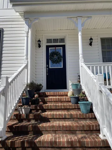 a view of entryway with wooden floor