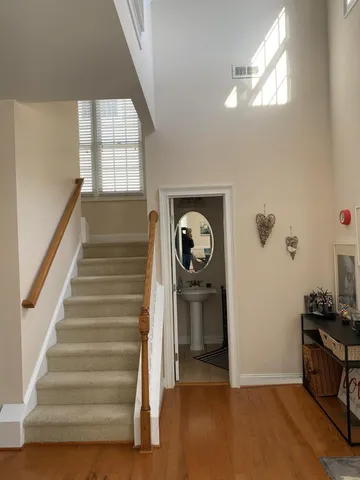 a view of entryway with stairs and wooden floor