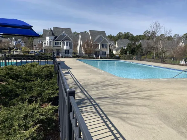 a view of a swimming pool with a chairs