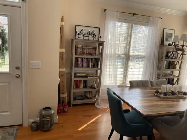 a view of a livingroom with furniture and a window