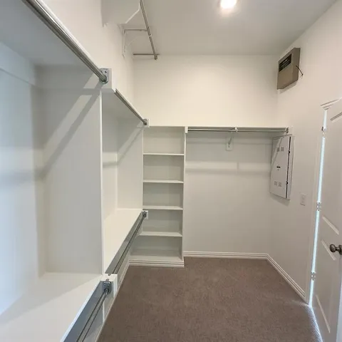 a view of an empty walk in closet