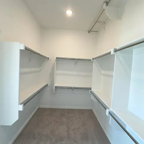a view of an empty walk in closet