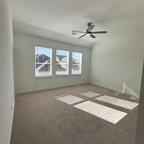 a view of an empty room with windows