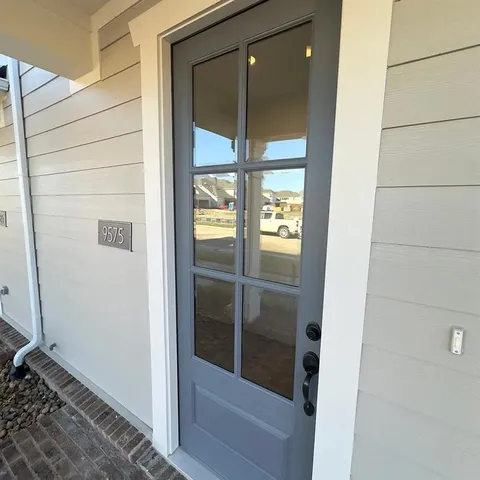 a bathroom with a glass shower door