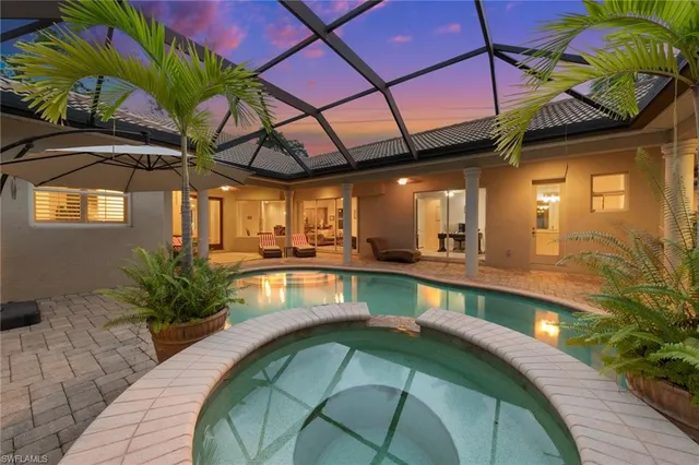 a view of a swimming pool with a patio