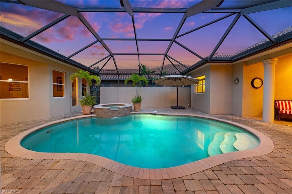 20060 Markward Crossing Estero, FL 33928 - Photo 13 of 50 a view of a swimming pool with a patio