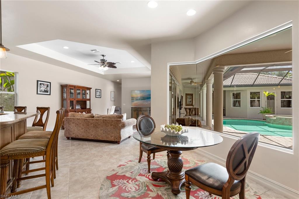 20060 Markward Crossing Estero, FL 33928 - Photo 25 of 50 a living room with furniture and a dining table