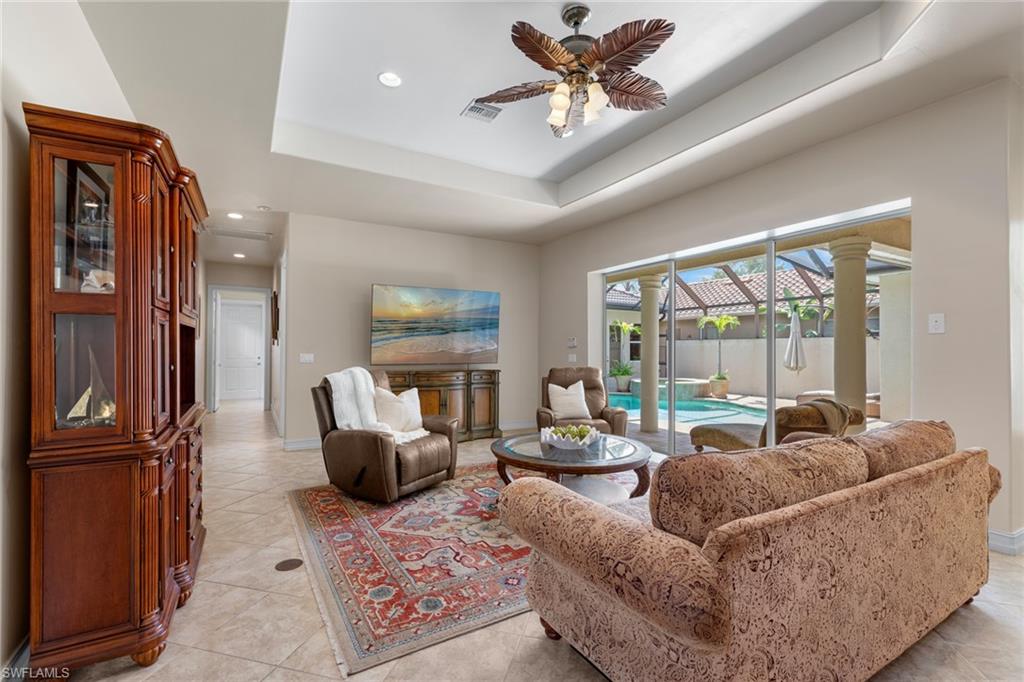 20060 Markward Crossing Estero, FL 33928 - Photo 27 of 50 a living room with furniture and a large window