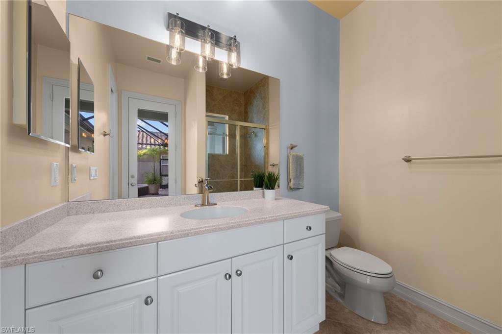 20060 Markward Crossing Estero, FL 33928 - Photo 31 of 50 a bathroom with a sink a toilet and shower