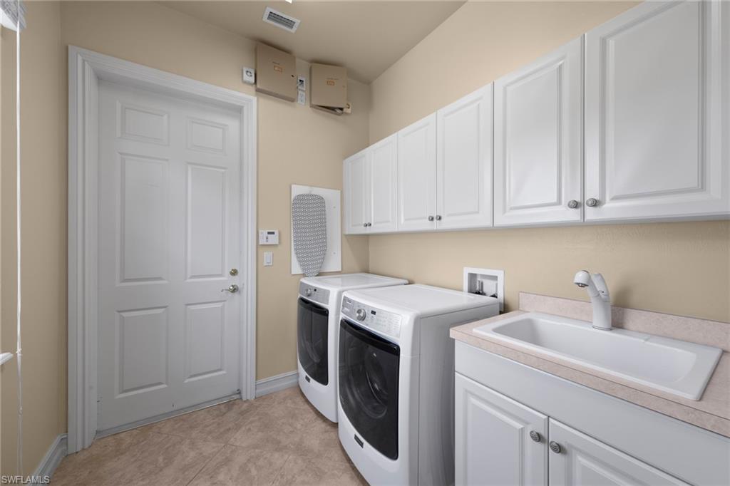20060 Markward Crossing Estero, FL 33928 - Photo 32 of 50 a utility room with sink dryer and washer