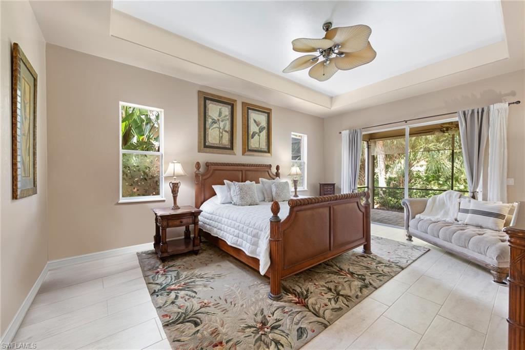 20060 Markward Crossing Estero, FL 33928 - Photo 33 of 50 a bed room with a bed and a couch