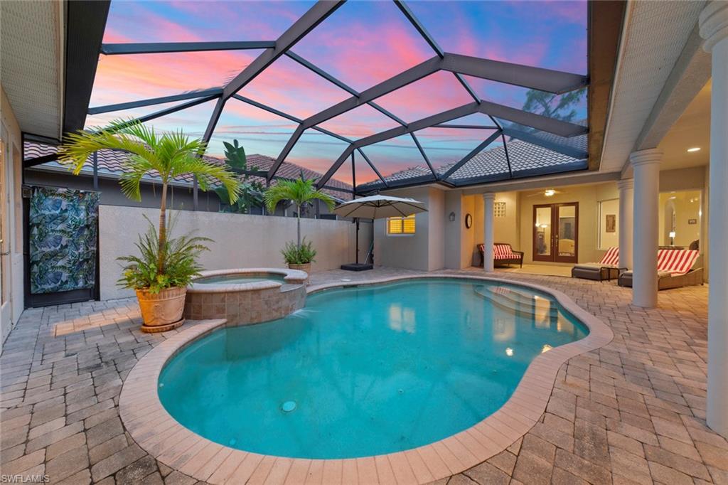 20060 Markward Crossing Estero, FL 33928 - Photo 4 of 50 a view of a swimming pool with a patio