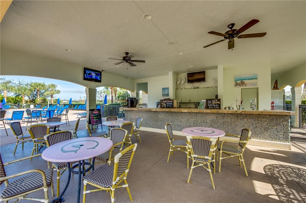 20060 Markward Crossing Estero, FL 33928 - Photo 44 of 49 a view of a dining room with furniture and a floor to ceiling window