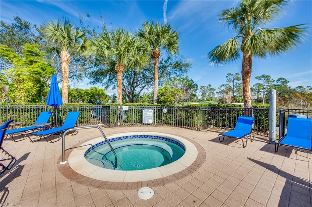 20060 Markward Crossing Estero, FL 33928 - Photo 47 of 50 a view of a swimming pool with a patio and a garden