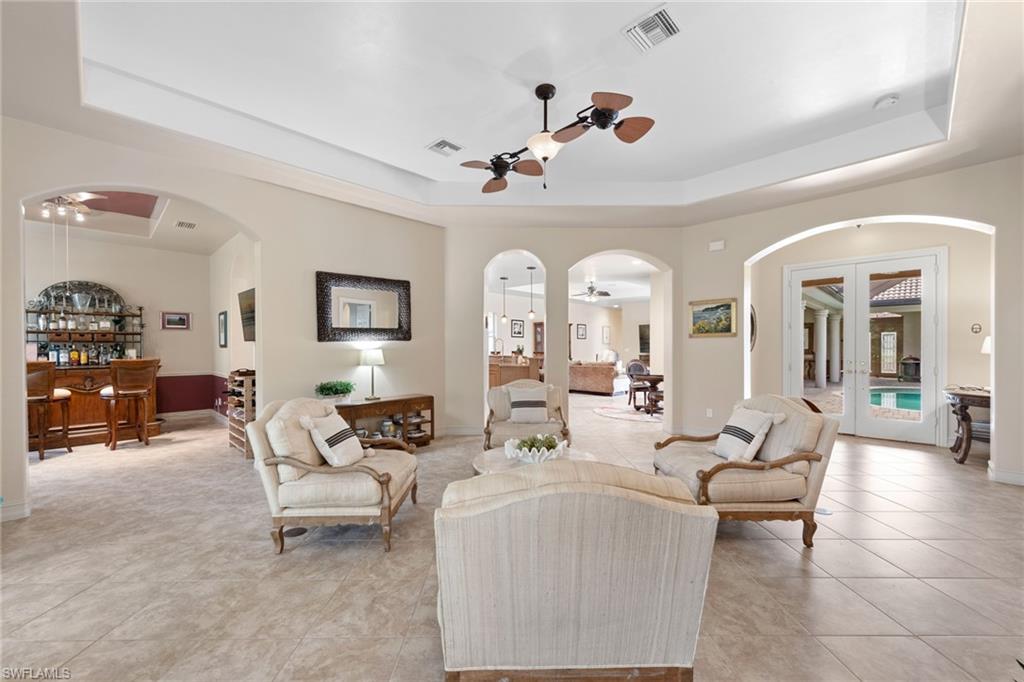 20060 Markward Crossing Estero, FL 33928 - Photo 6 of 50 a living room with furniture and wooden floor