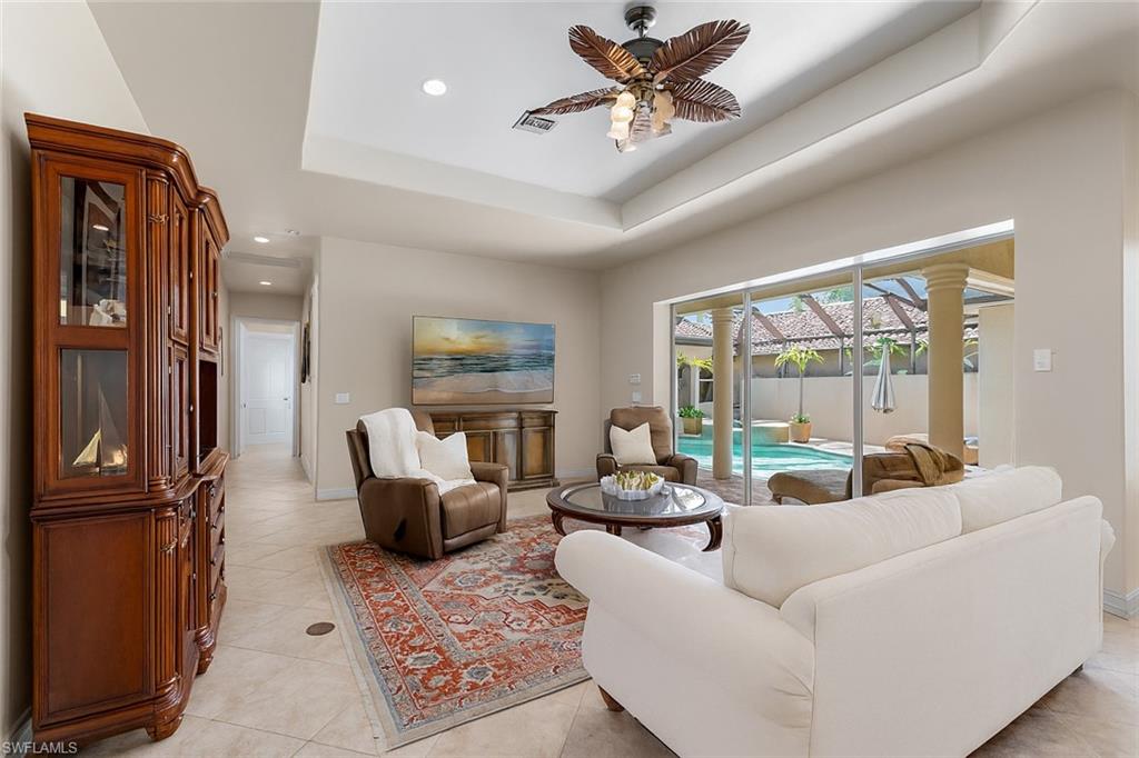 20060 Markward Crossing Estero, FL 33928 - Photo 9 of 50 a living room with furniture wooden floor and a large window