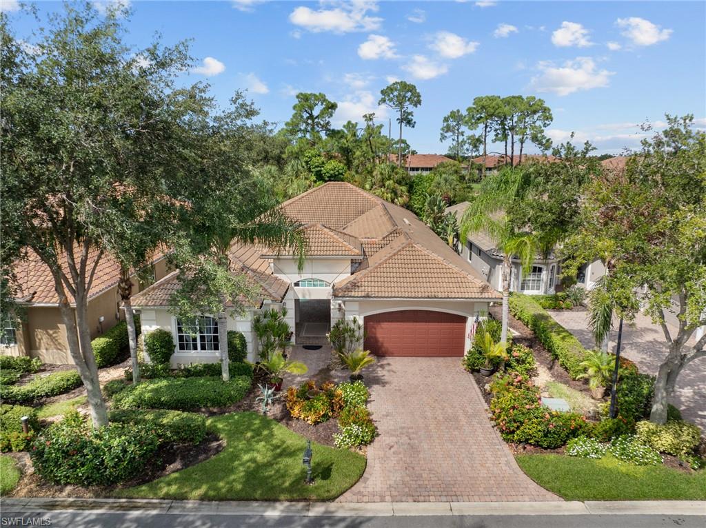 20060 Markward Crossing Estero, FL 33928 - Photo 10 of 50 a front view of a house with a yard and garage