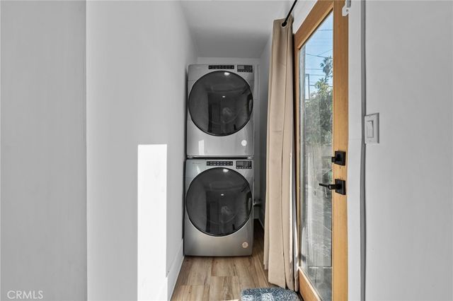 a view of a hallway with washer and dryer