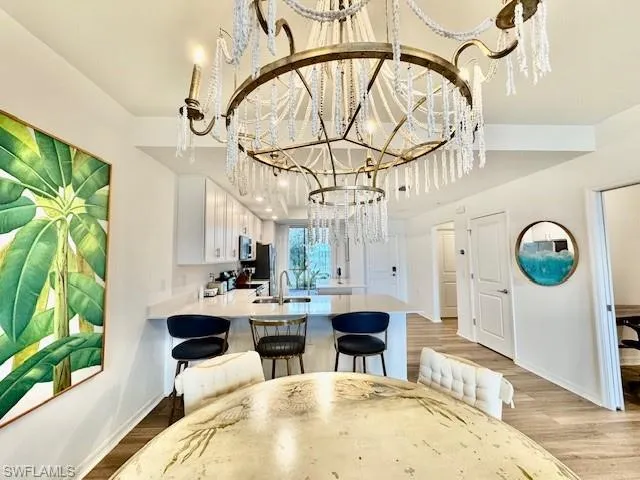 a living room with patio furniture and a large window