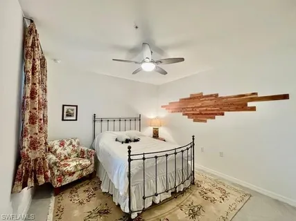 a bedroom with furniture and a window